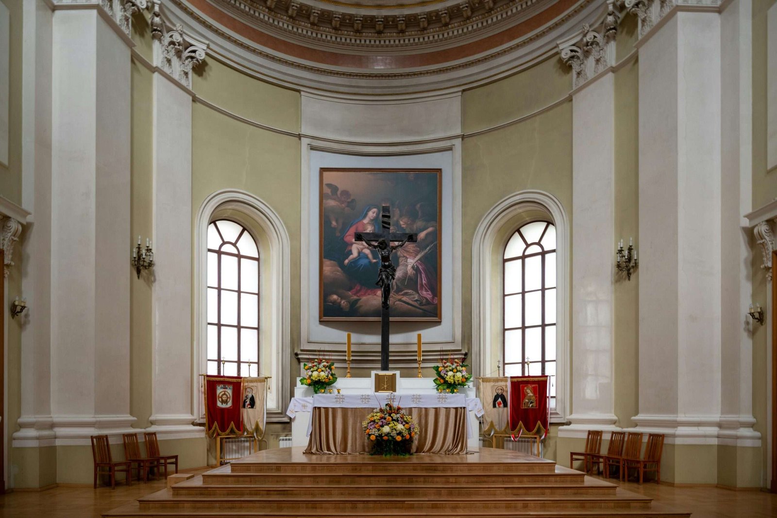 pexels-photo-32591606-32591606 Beautiful church interior featuring a detailed altar with a crucifix and religious artwork.